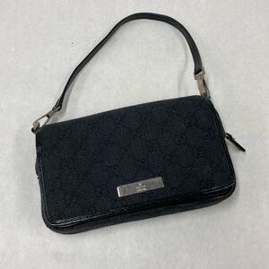 Gucci brand clutch. Color: black